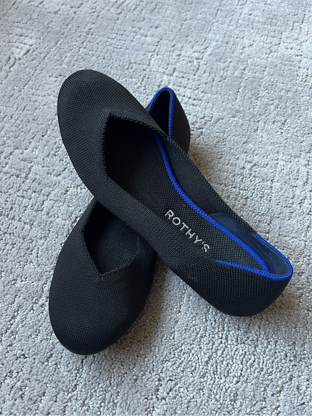 Rothy's The Flat Round Toe Black Slip-On Ballet Flat with Blue Trim